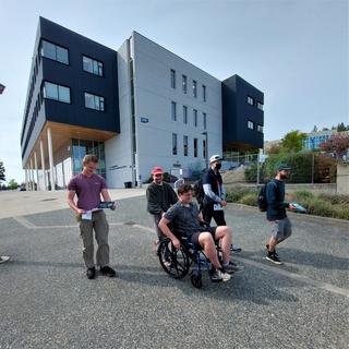 students learning to navigate in a wheelchair on the VIU Nanaimo campus.