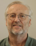 man with glasses, short grey hair and beard